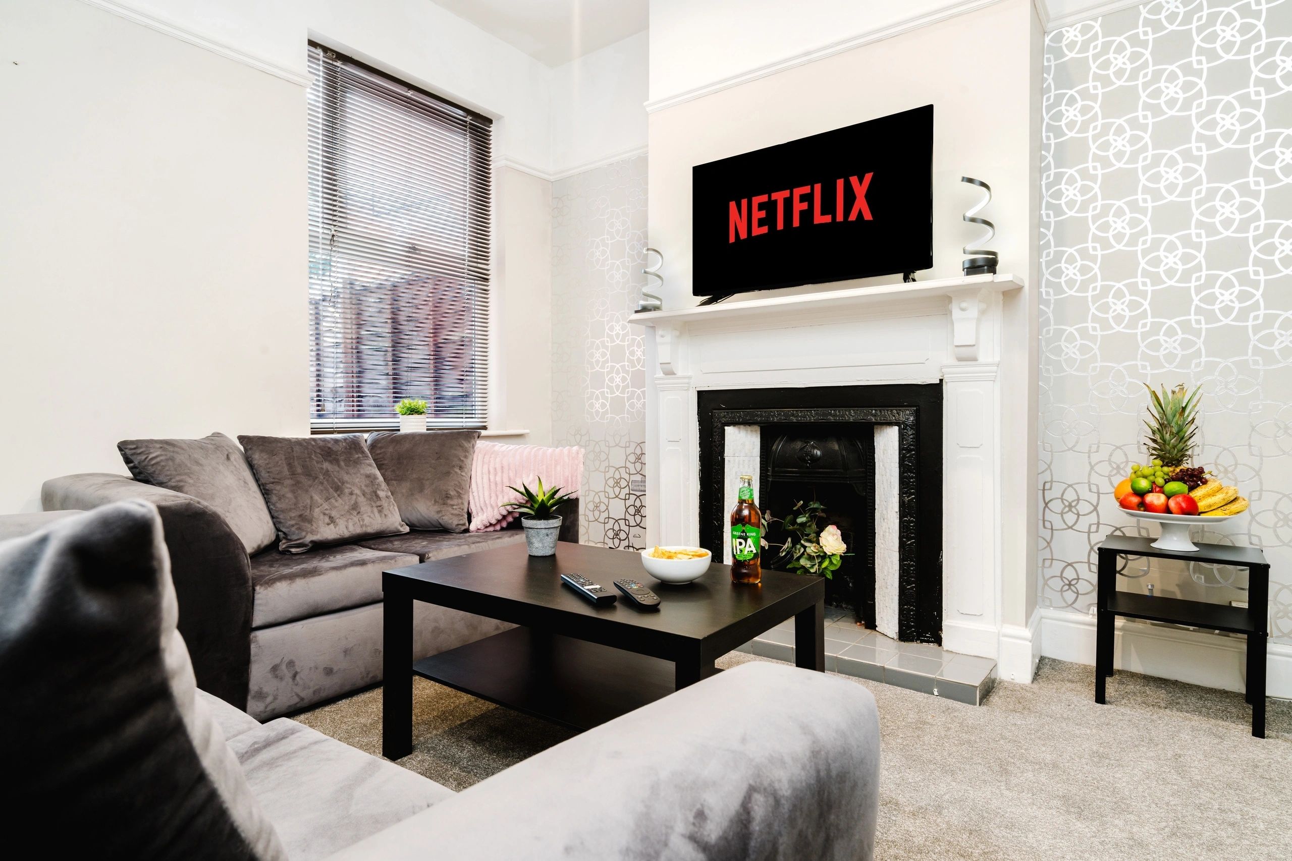 SCC Homes Birmingham living room with fireplace and television
